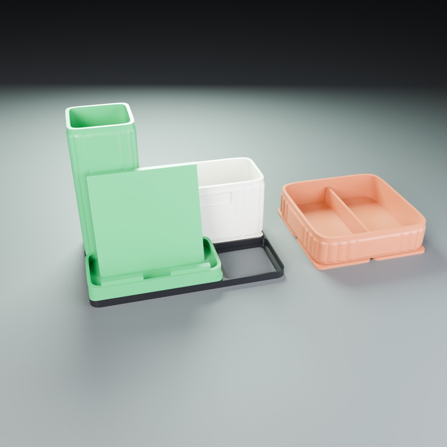 A desk organizer with a pen cup, a bin and a tray on a base plate
