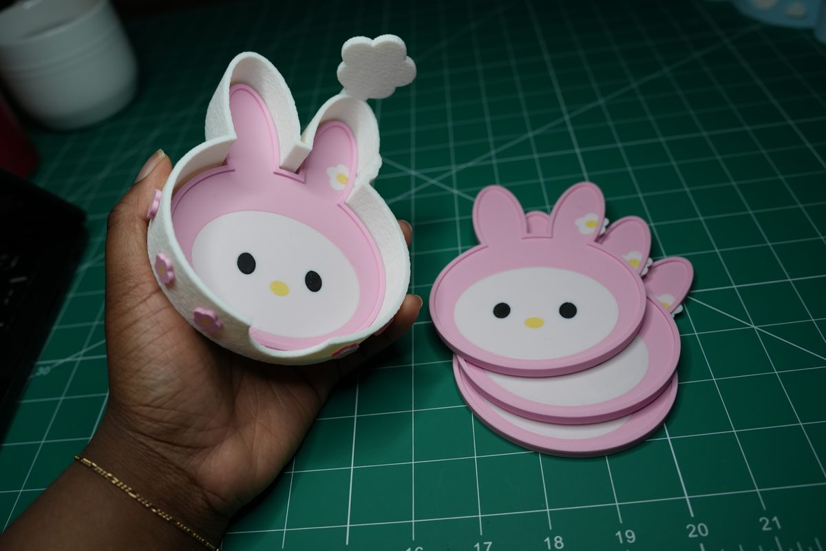 The bunny holder in a hand, a coaster inside
