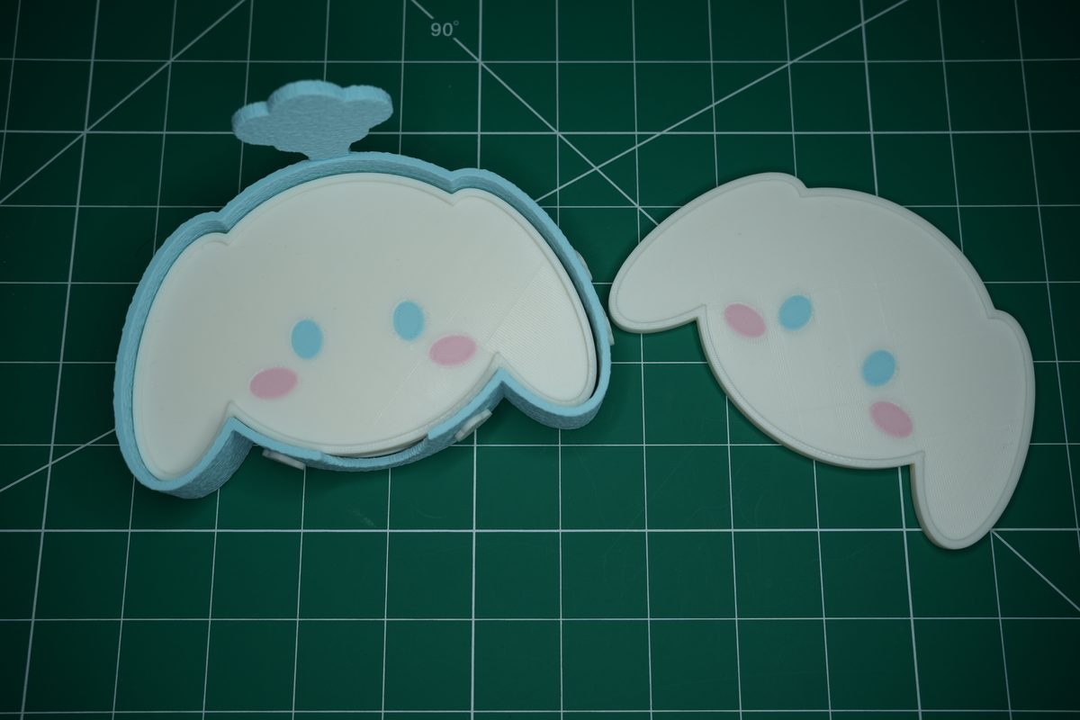 The full holder beside a stack of puppy coasters