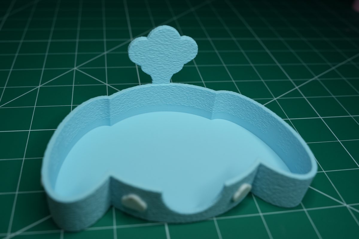 The empty blue holder: fuzzy outside, smooth pocket, cloud on the back