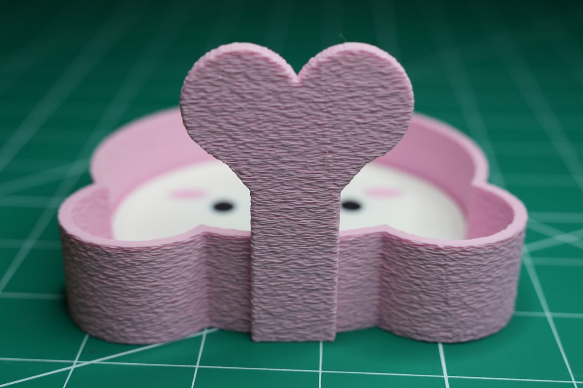 The heart on the holder’s back wall, with the fuzzy-skin texture